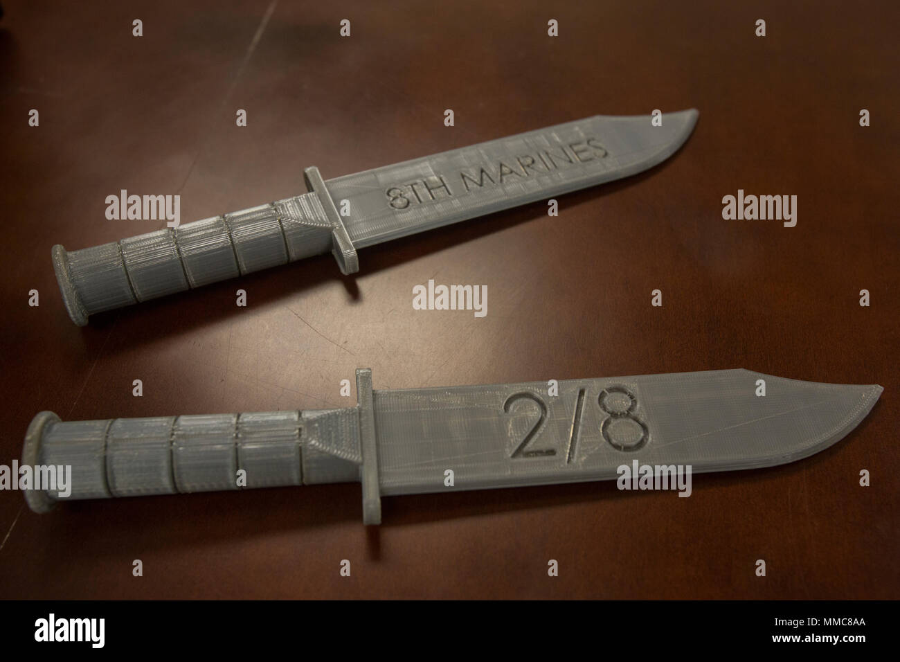 Two 3-D printed knives from 2nd Battalion, 8th Marine Regiment at Camp Lejeune, N.C., Oct. 6, 2017. 2/8 is the first infantry battalion in the United States Marine Corps to utilize a 3-D printer to ensure battalion readiness in the event of equipment malfunctions. (U.S. Marine Corps photo by Lance Cpl. Ashley McLaughlin) Stock Photo