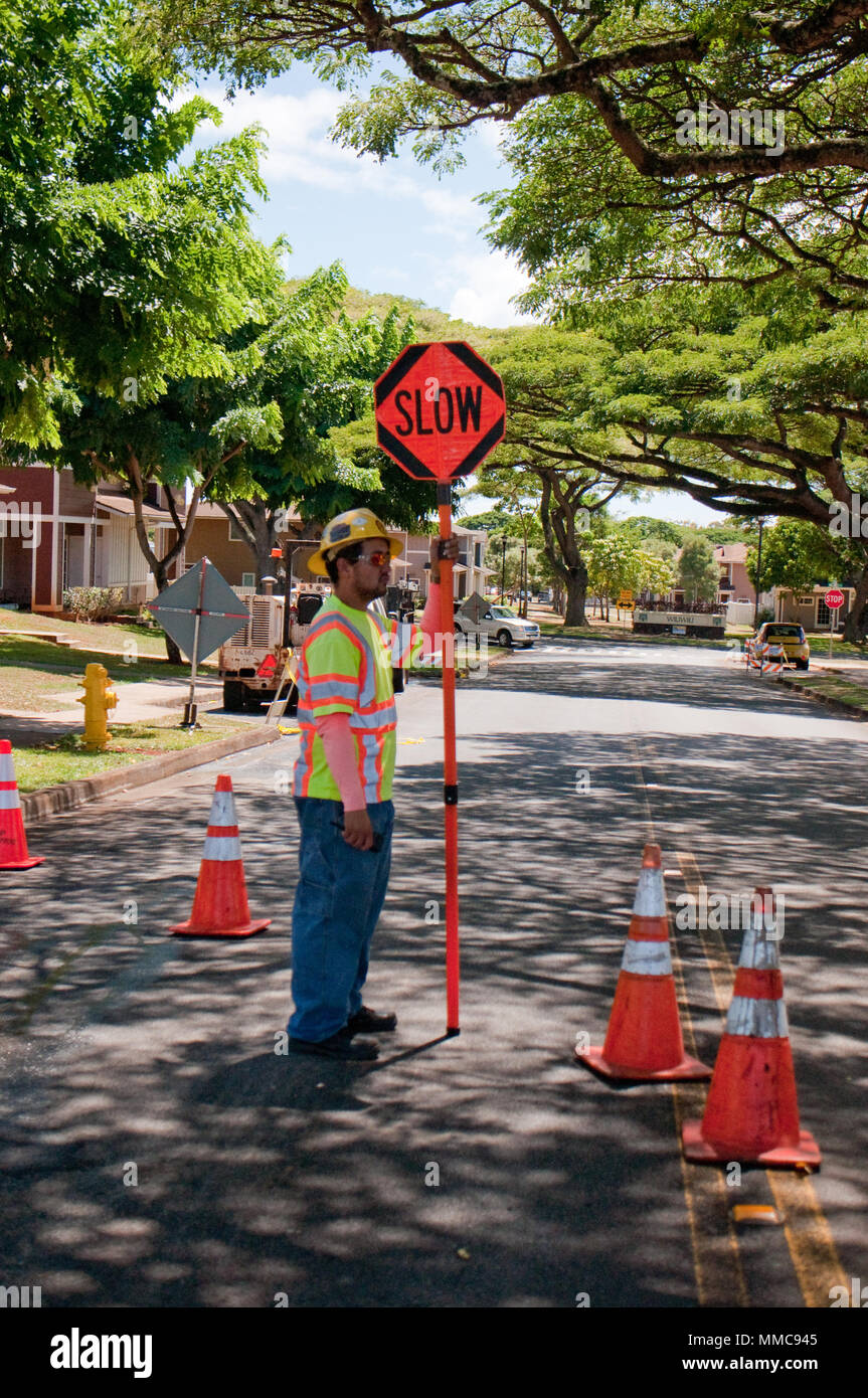 WHEELER ARMY AIRFIELD — James Fase, a traffic tech with Grace Pacific LLC, stands by to direct traffic during the repaving of Lauhala Road near the Wili Wili neighborhood at Wheeler Army Airfield, Sept. 27, 2017. (U.S. Army photo by Kristen Wong, Oahu Publications) Stock Photo