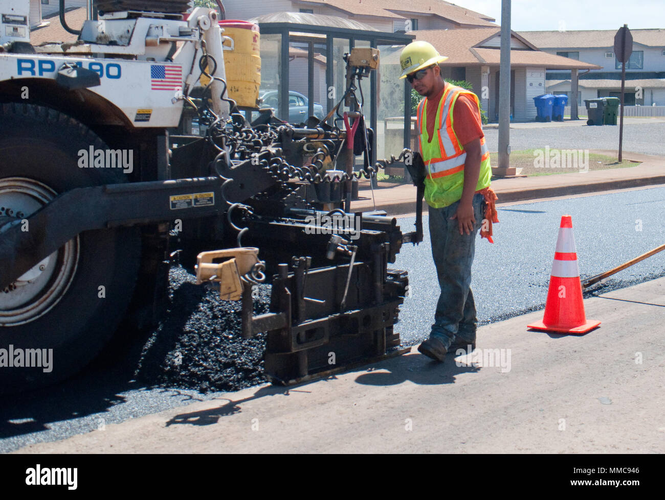 WHEELER ARMY AIRFIELD — Cody Castro, a laborer with Grace Pacific LLC, works on repaving Lauhala Road near the Wili Wili neighborhood at Wheeler Army Airfield, Sept. 27, 2017. (U.S. Army photo by Kristen Wong, Oahu Publications) Stock Photo