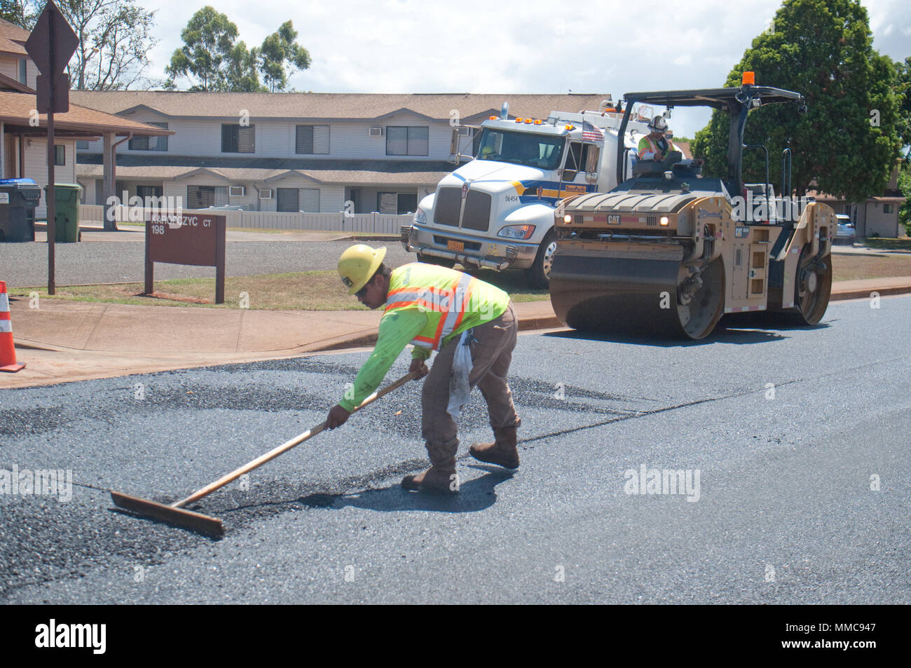 WHEELER ARMY AIRFIELD — Gilbert Torris, a laborer, and Derek Sanico, a rollerman, both with Grace Pacific LLC, work on repaving Lauhala Road near the Wili Wili neighborhood at Wheeler Army Airfield, Sept. 27, 2017. (U.S. Army photo by Kristen Wong, Oahu Publications) Stock Photo