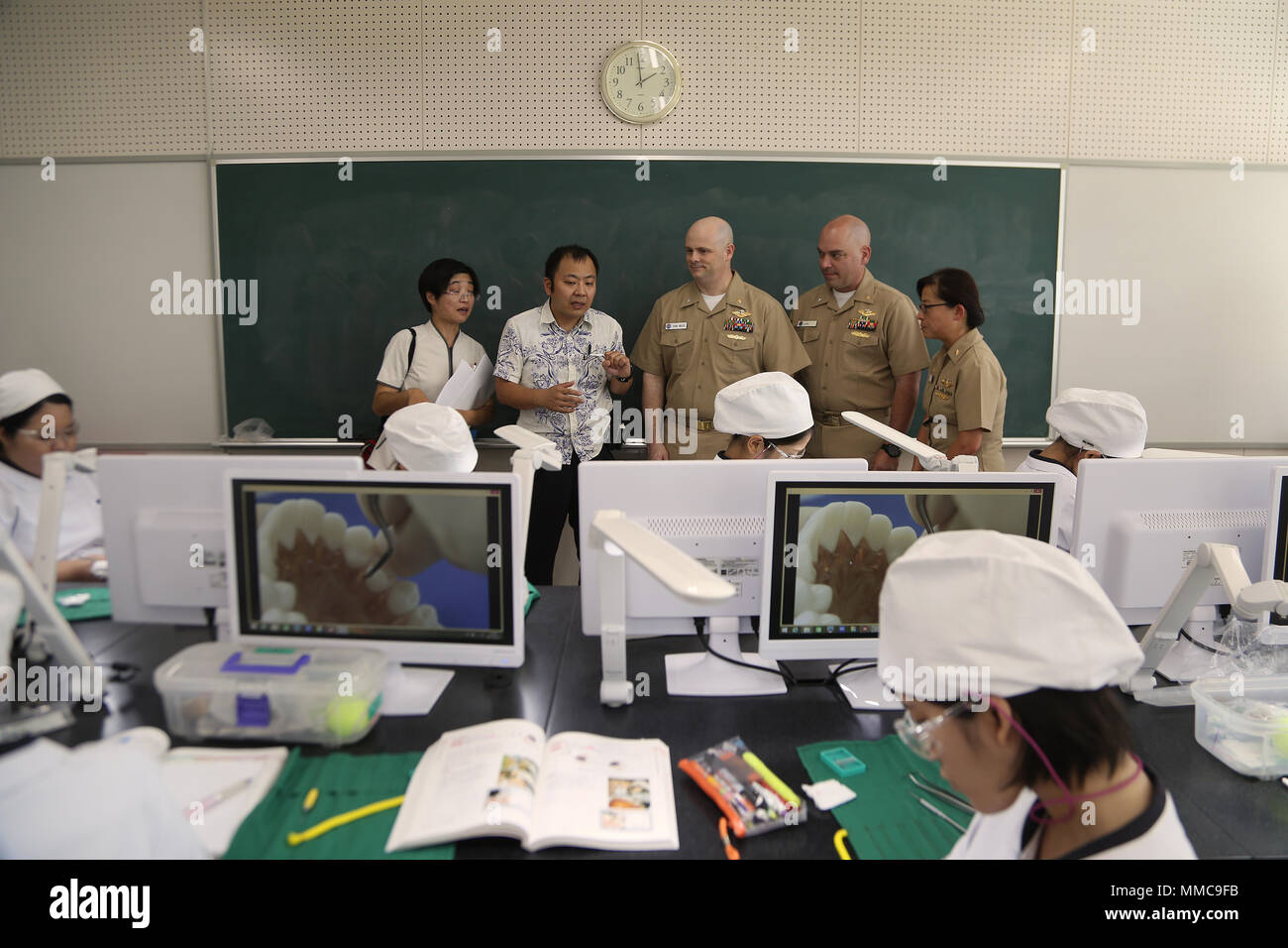 The 3d Dental Battalion command deck learns about the Okinawa Dental Hygiene School during their