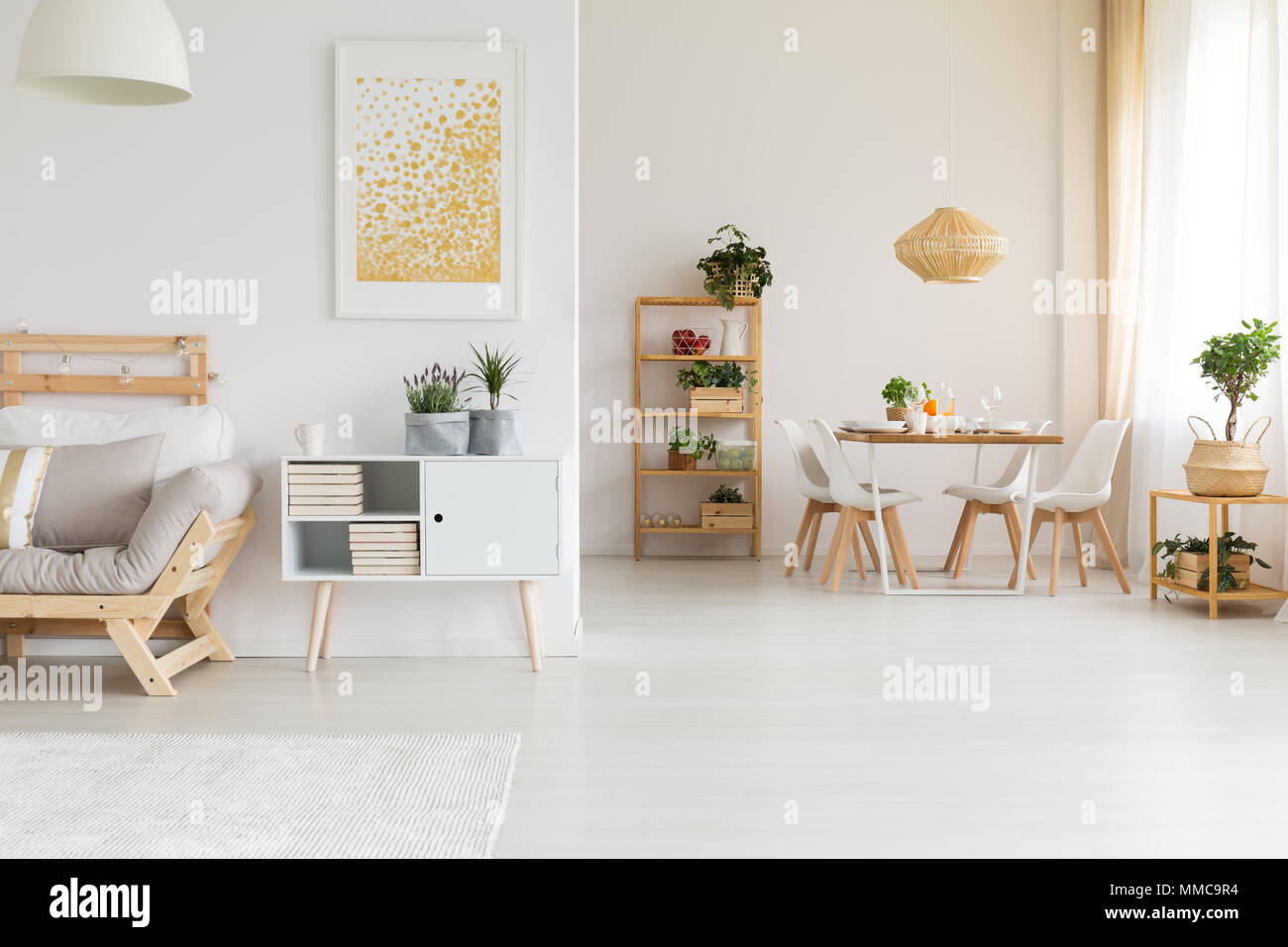 Dining and living room in one stylish space Stock Photo