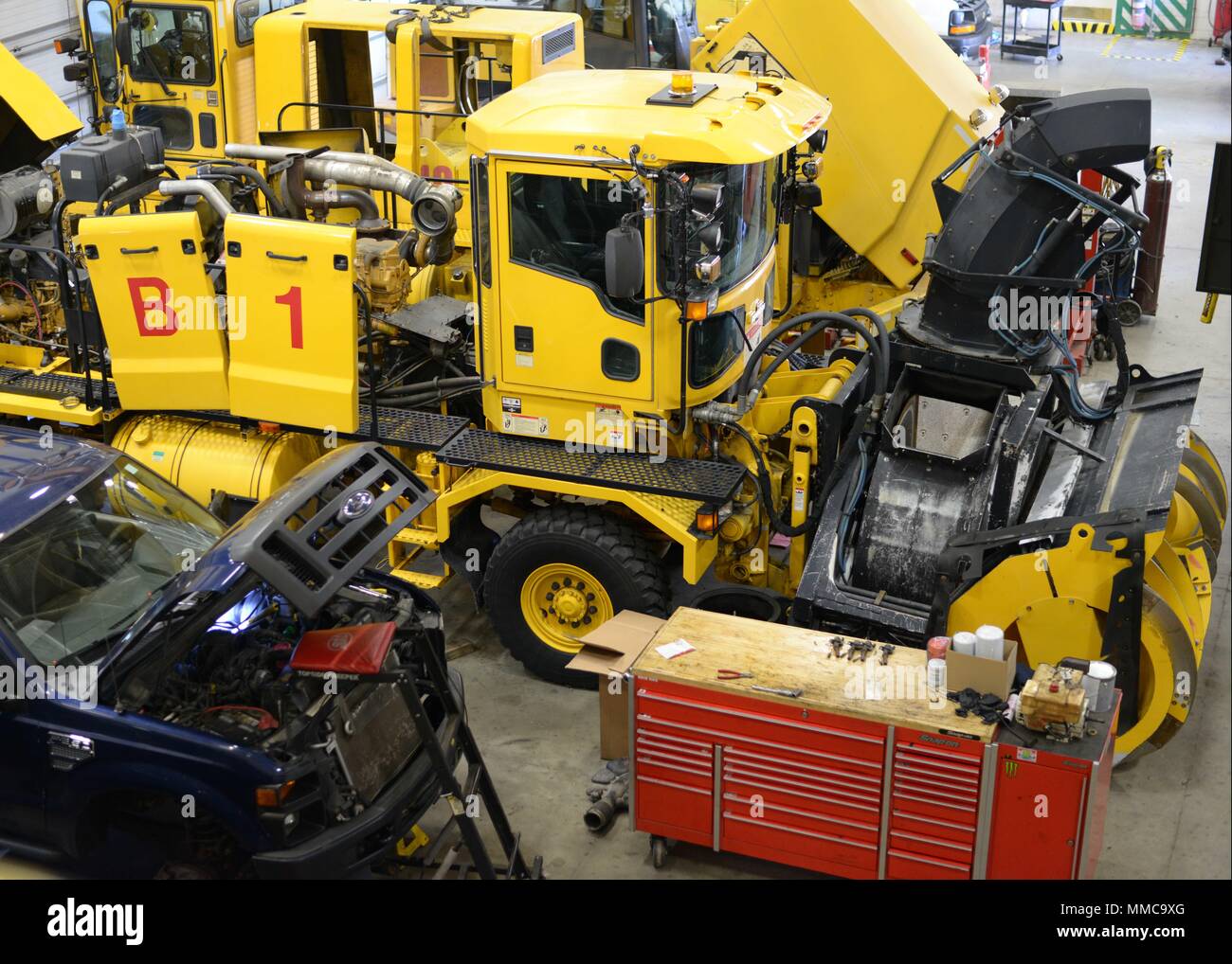 Vehicle Maintenance Airmen with the 101st Air Refueling Wing are gearing up for winter and the inevitable snow to follow by performing maintenance on all 21 snow removal vehicles designed to keep the runways clear at the Bangor International Airport, 101 ARW, Bangor, ME, October 12, 2017. Seen here is an Oshkosh blower vehicle which can throw snow up to 200 feet in a rate of as much as 5,000 ton an hour. Stock Photo