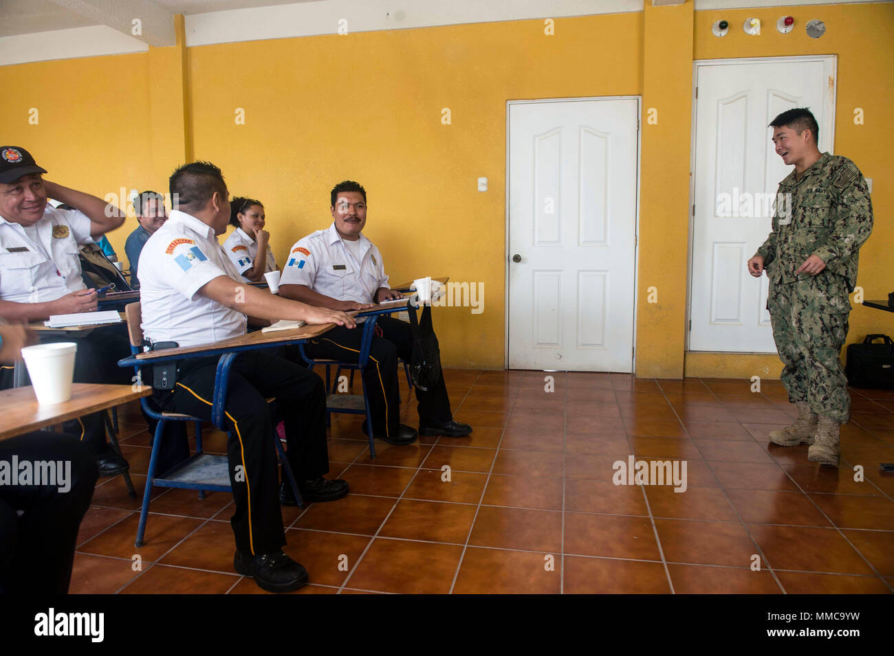 171011-N-YM856-0042 PUERTO BARRIOS, Guatemala (Oct. 11, 2017) Hospital Corpsman 2nd Class Yang Yang, a preventive medicine technician assigned to Navy Environmental Preventive Medicine Unit 5, speaks to Guatemalan first responders about respiratory protection during Southern Partnership Station 17 (SPS 17). SPS 17 is a U.S. Navy deployment executed by U.S. Naval Forces Southern Command/U.S. 4th Fleet, focused on subject matter expert exchanges with partner nation militaries and security forces in Central and South America. (U.S. Navy Combat Camera photo by Mass Communication Specialist 2nd Cla Stock Photo