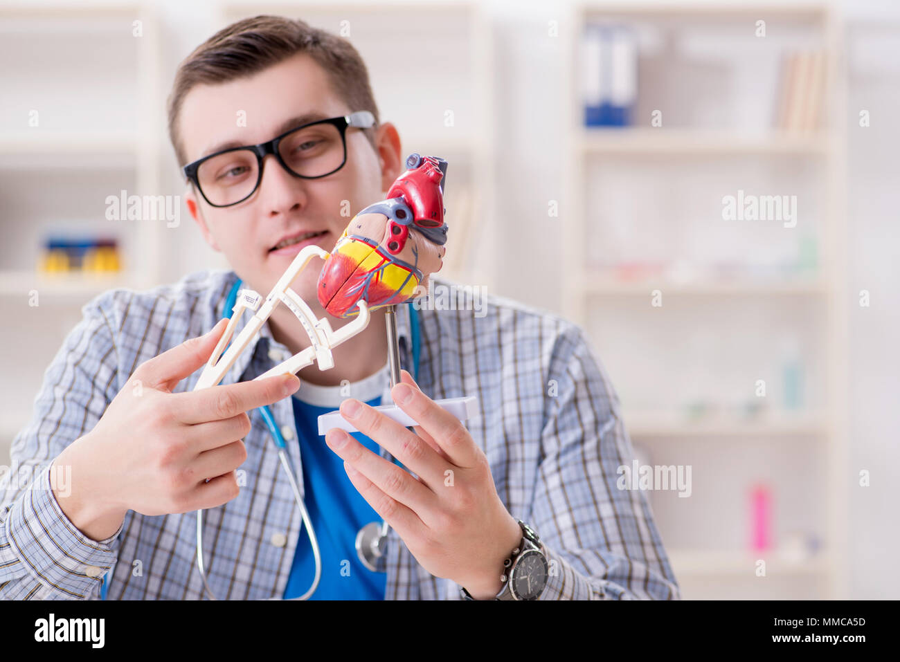 Medical student studying heart in classroom during lecture Stock Photo ...