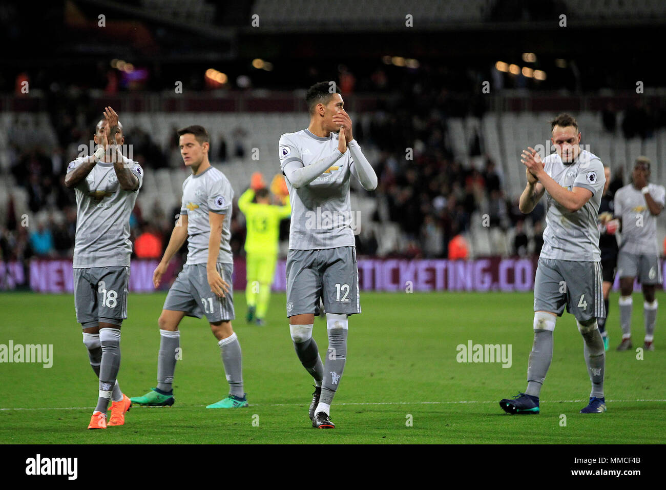 London, UK. 10th May 2018. Chris Smalling © , Ashley Young (L) and Phil Jones of Manchester United (R) clap the fans after the game Premier League match, West Ham United v Manchester United at the London Stadium, Queen Elizabeth Olympic Park in London on  Thursday 10th May 2018.  this image may only be used for Editorial purposes. Editorial use only, license required for commercial use. No use in betting, games or a single club/league/player publications . pic by Steffan Bowen/Andrew Orchard sports photography/Alamy Live news Stock Photo