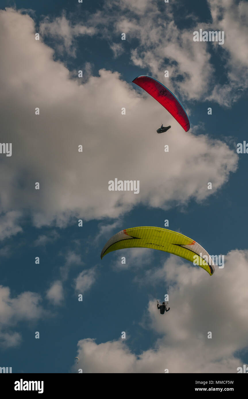 Brighton, Sussex, UK..10 May 2018..Cooler weather,  clouds & North Westerly wind brings Paraglider pilots to Devils Dyke on the South Downs Way. Stock Photo