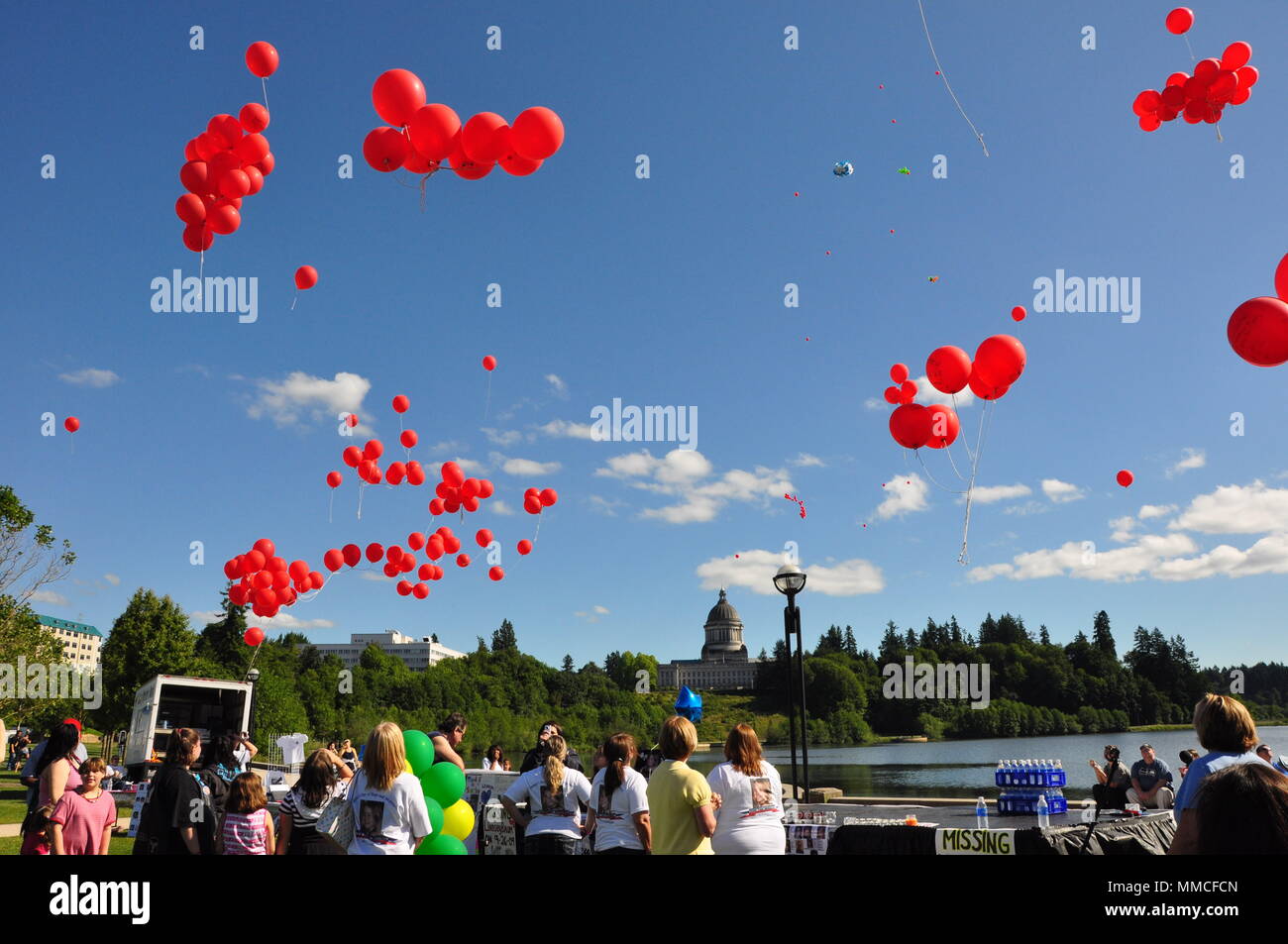 Balloons being released at Lindsey Baum's day of Remembrance in Olympia Washington,1 year after she was kidnapped.  Her remains were announced as found today. Stock Photo