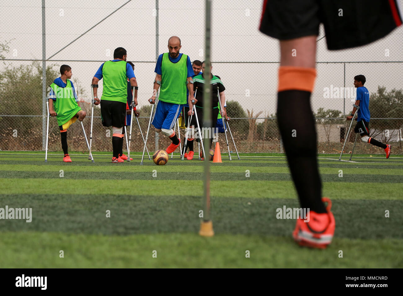 Gaza. 10th May, 2018. Palestinian amputee soccer players take part in a training session of their team at Municipality Stadium in Deir Al Balah, in the central Gaza Strip, on May 10, 2018. For the first time in the Palestinian Gaza Strip, a football team of male amputees was recently formed to lay the foundation for such a sport in the Israeli-blockaded territory. The 12-player team, named 'The Heroes', could be a glimmer of hope for many young people with amputations caused by frequent rounds of violence with Israel and other accidents. Credit: Stringer/Xinhua/Alamy Live News Stock Photo