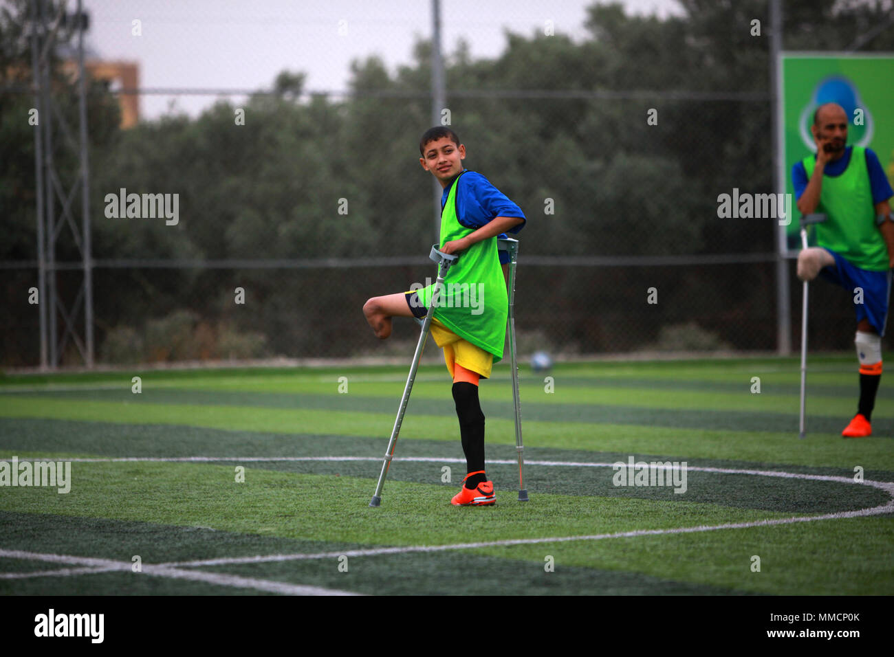 Gaza. 10th May, 2018. A Palestinian amputee soccer player exercises during a training session of their team at Municipality Stadium in Deir Al Balah, in the central Gaza Strip, on May 10, 2018. For the first time in the Palestinian Gaza Strip, a football team of male amputees was recently formed to lay the foundation for such a sport in the Israeli-blockaded territory. The 12-player team, named 'The Heroes', could be a glimmer of hope for many young people with amputations caused by frequent rounds of violence with Israel and other accidents. Credit: Stringer/Xinhua/Alamy Live News Stock Photo