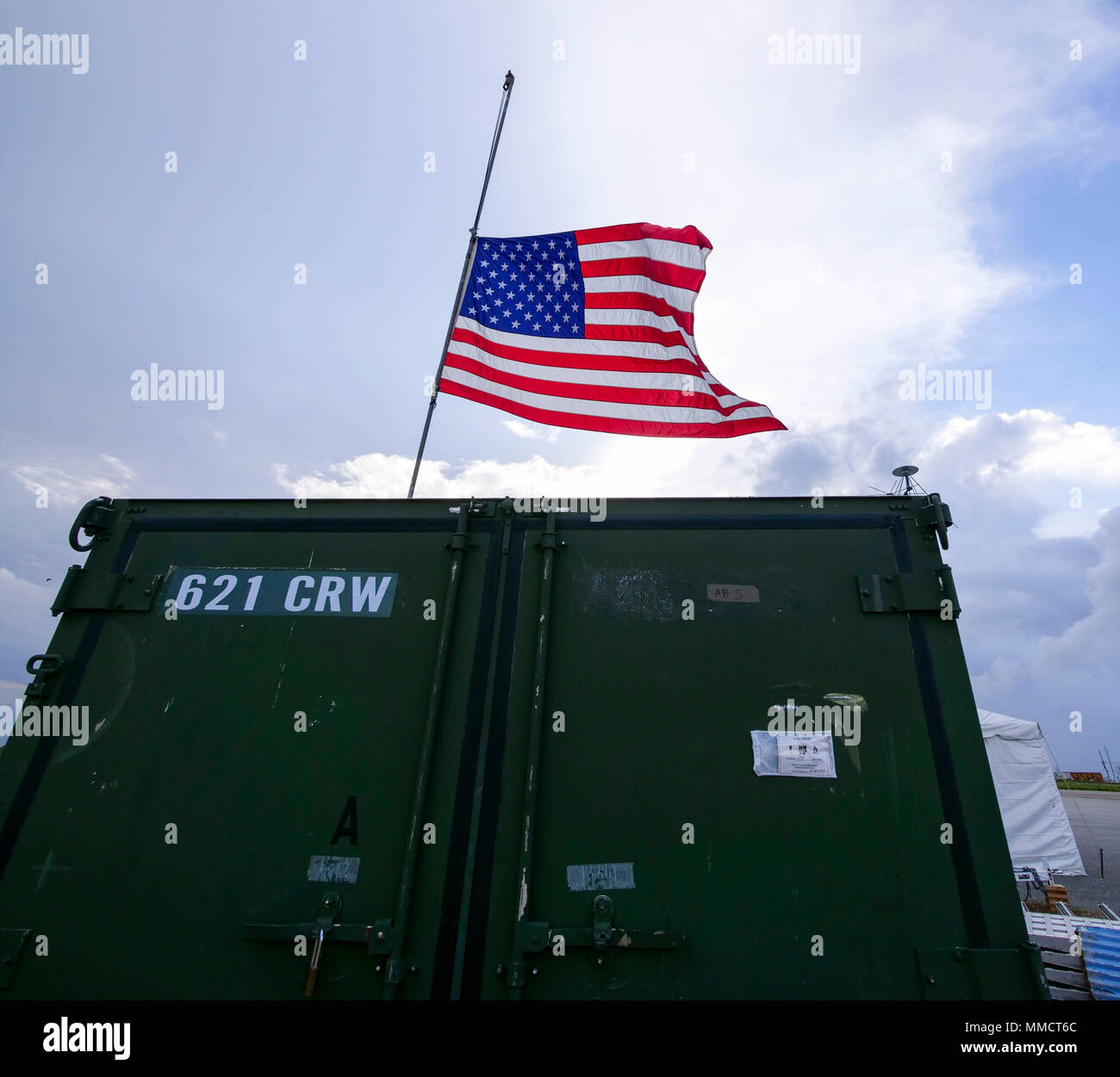 An American flag flys at half-mast at Rafael Hernández Airport in  Aguadilla, Puerto Rico, Oct. 6, 2017. The 821st Contingency Response Group  reopened the airfield soon after Hurricane Maria devastated the area