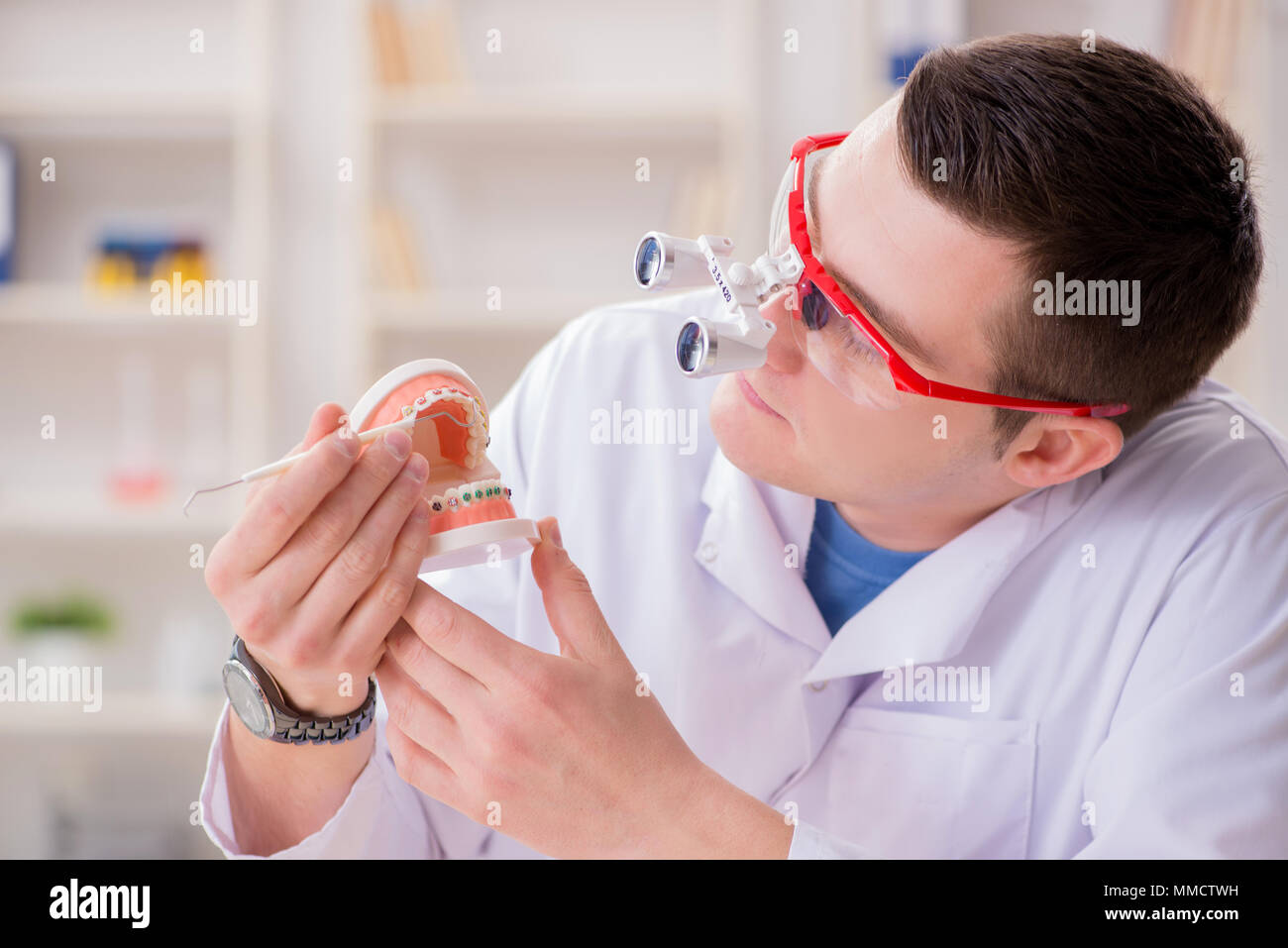Dentist working teeth implant in medical lab Stock Photo - Alamy