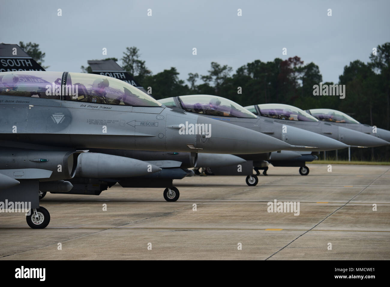 U.S. Air Force F-16 fighter jets from the South Carolina Air National Guard’s 169th Fighter Wing prepare for takeoff during end-of-runway operations at McEntire Joint National Guard Base, S.C., Oct. 14, 2017. This was part of routine training ensuring that the SCANG remains ready to accomplish the mission at a moment’s notice. (U.S. Air National Guard photo by Senior Airman Megan Floyd) Stock Photo