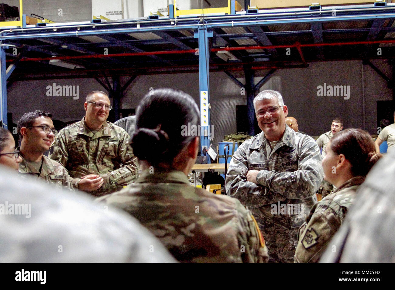 Maj. Gen. Tony Carrelli, Pennsylvania’s adjutant general, speaks with Soldiers from the 108th Area Support Medical Company, 213th Regional Support Group, Pennsylvania Army National Guard and Soldiers from the PAARNG Medical Detachment before their departure for the U.S. Virgin Islands October 12, 2017 in Harrisburg, Pennsylvania. The Soldiers will be providing continuous medical care to the citizens of the U.S. Virgin Islands as well as providing ongoing medical care to U.S. troops currently operating on the U.S. Virgin Islands. (U.S. Army National Guard photo by Spc. Anna Churco) Stock Photo
