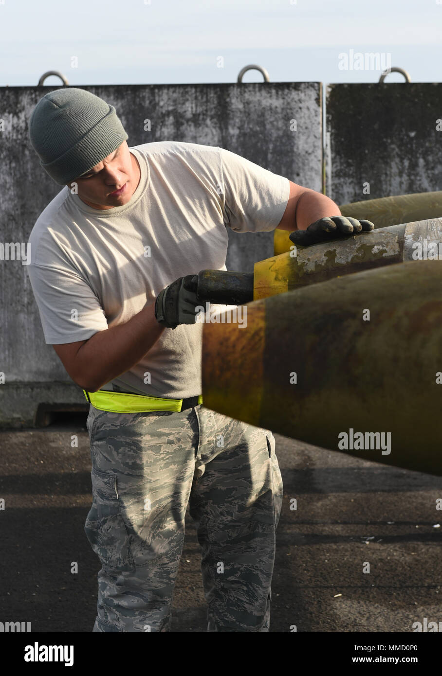 U.S. Air Force Master Sgt. Jason Lee, 7th Munitions Squadron munitions specialist, inserts a nose plug to the tip of a guided bomb unit at RAF Fairford, U.K., Oct. 12, 2017. The 7th MUNS plays a key role in B-1B Lancer training and mission readiness by storing, maintaining and delivering quality munitions, and maintaining munitions release system. (U.S. Air Force photo by Airman 1st Class Emily Copeland) Stock Photo