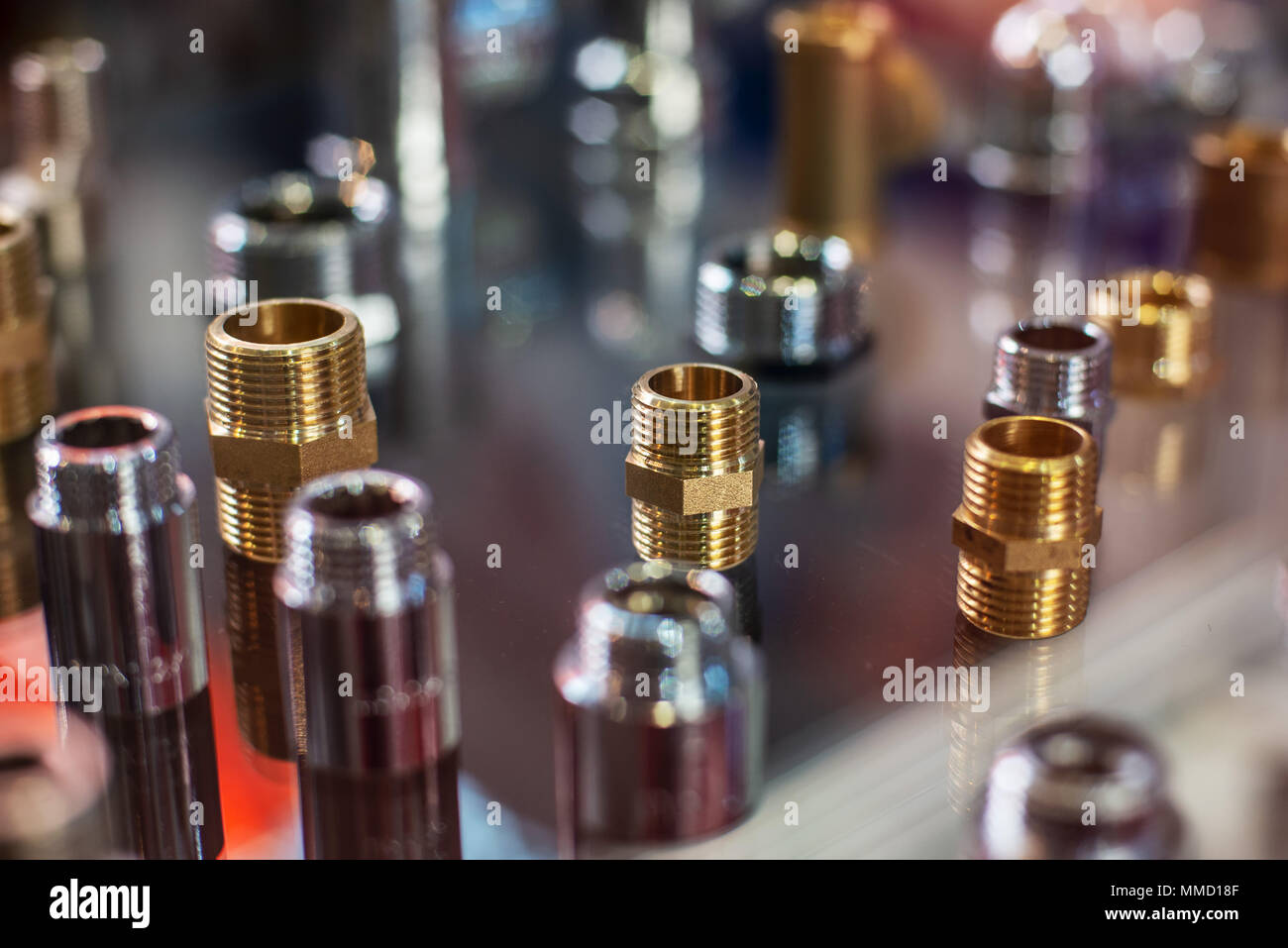 close up high tech many kind of quick coupling brass metal connector equipment for air water and oil on glass bable Stock Photo