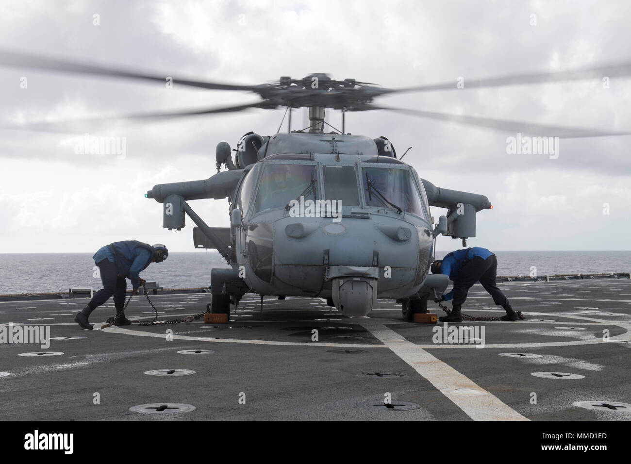171015-N-DQ503-052 CARIBBEAN SEA (Oct. 15, 2017) Sailors chock and chain an MH60S Seahawk helicopter on the flight deck of the dock landing ship USS Oak Hill (LSD 51). The Department of Defense is supporting Federal Emergency Management Agency, the lead federal agency, in helping those affected by Hurricane Maria to minimize suffering and is one component of the overall whole-of-government response effort. (U.S. Navy photo by Mass Communication Specialist 3rd Class Taylor A. Elberg) Stock Photo