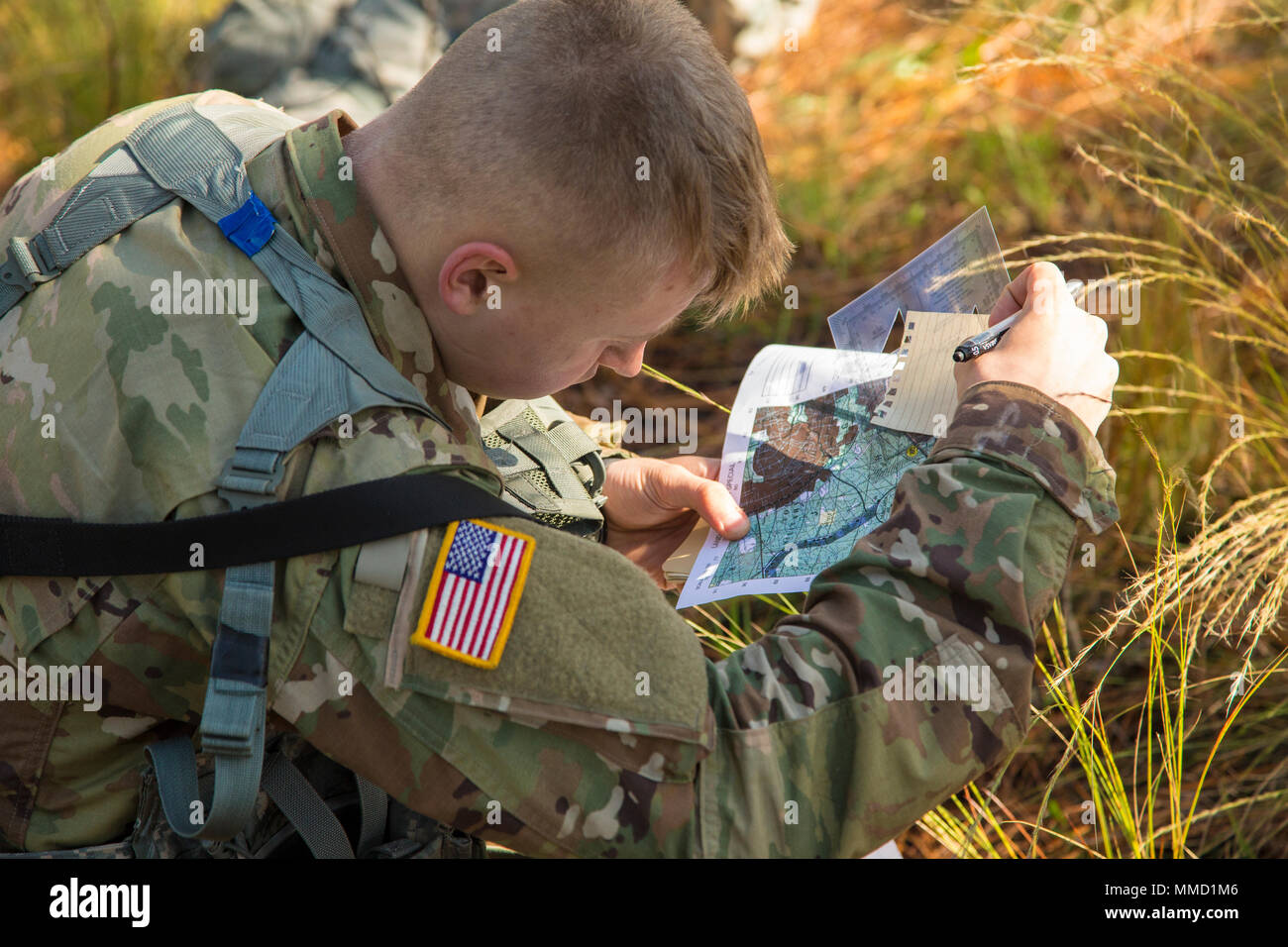 U.S. Army Soldier plots their points during the land navigation course