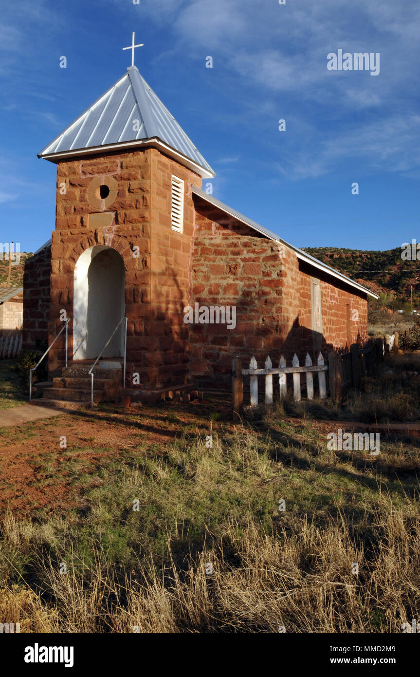The historic Catholic church in the Route 66 town of Cuervo, New Mexico, dates from 1915. Stock Photo