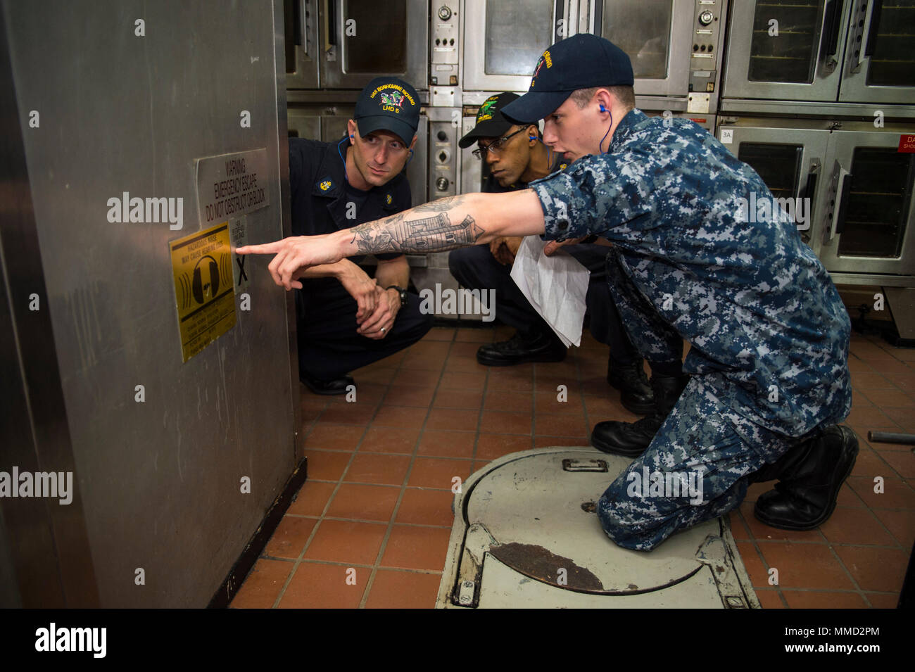 N Xt039 021 Sasebo Japan Oct 11 17 Culinary Specialist Seaman Brandon Lontoc Front From Chicago Verifies The Location Of An Assigned Maintenance To Chief Machinery Repairman Troy Williams Center An Afloat Training Group