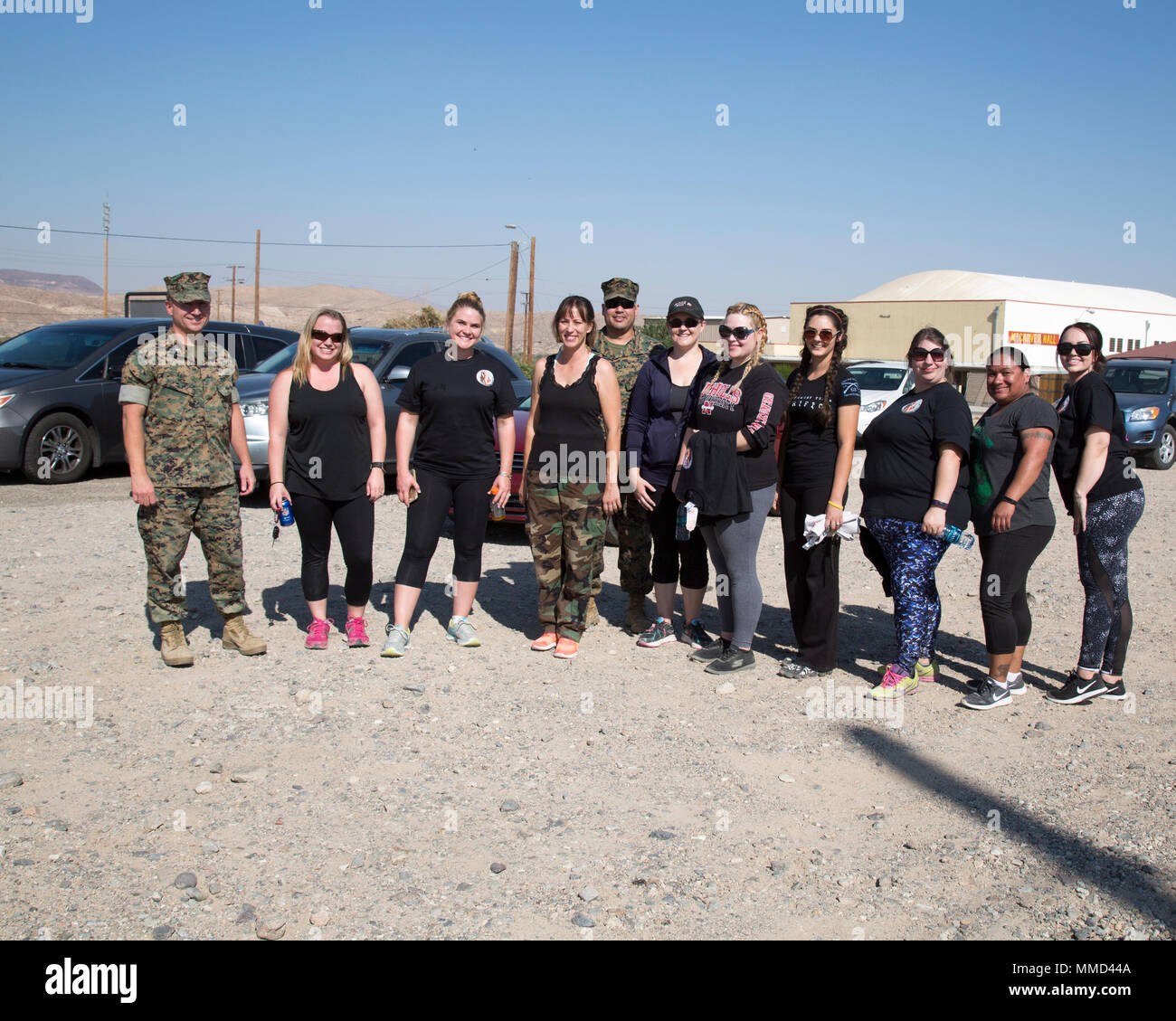 Liutenant Colonel Kenneth Lee, base executive officer, poses with military spouses at the end of Jane Wayne Day aboard Marine Corps Logistics Base Barstow, Calif.,Oct. 13. Stock Photo