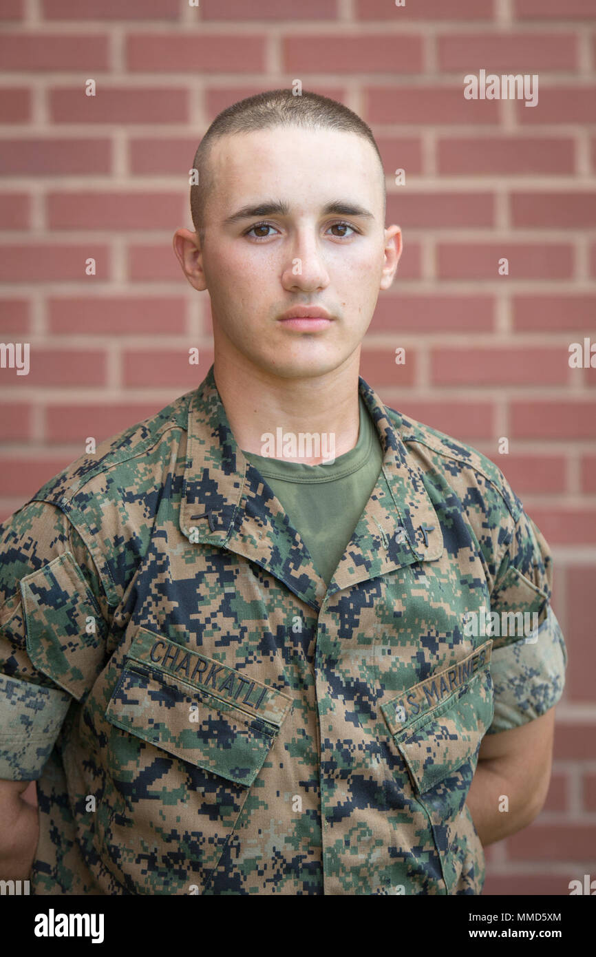 Pfc. Izat Charkatli, Platoon 3073, Lima Company, 3rd Recruit Training Battalion, earned U.S. citizenship Oct. 12, 2017, on Parris Island, S.C. Before earning citizenship, applicants must demonstrate knowledge of the English language and American government, show good moral character and take the Oath of Allegiance to the U.S. Constitution. Charkatli, from Woodbridge, VA., originally from Canada, is scheduled to graduate Oct. 13, 2017. (Photo by Cpl. Joseph Jacob) Stock Photo