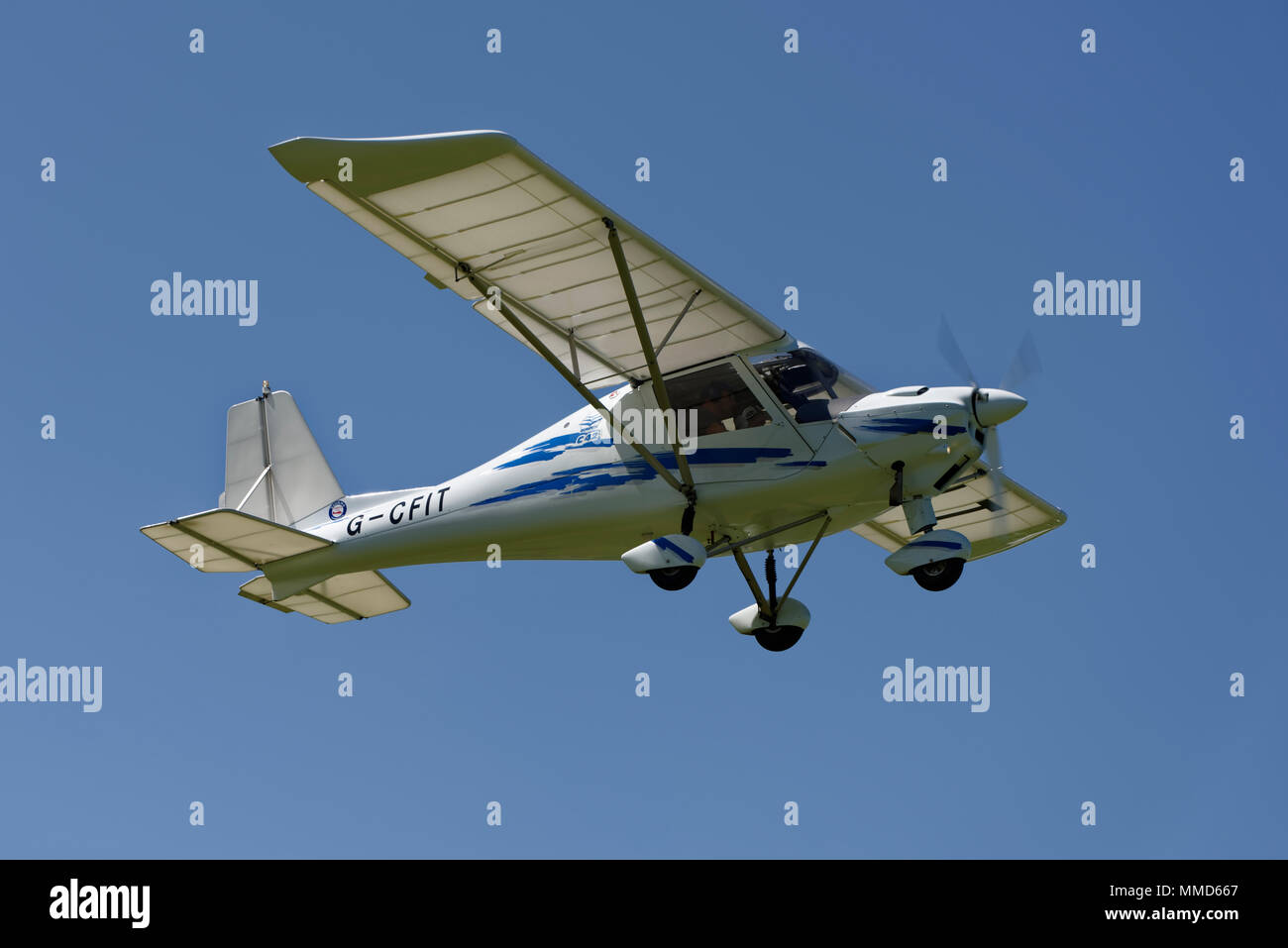 Ikarus C42 light aircraft takes off from Popham Airfield in Hampshire UK Stock Photo