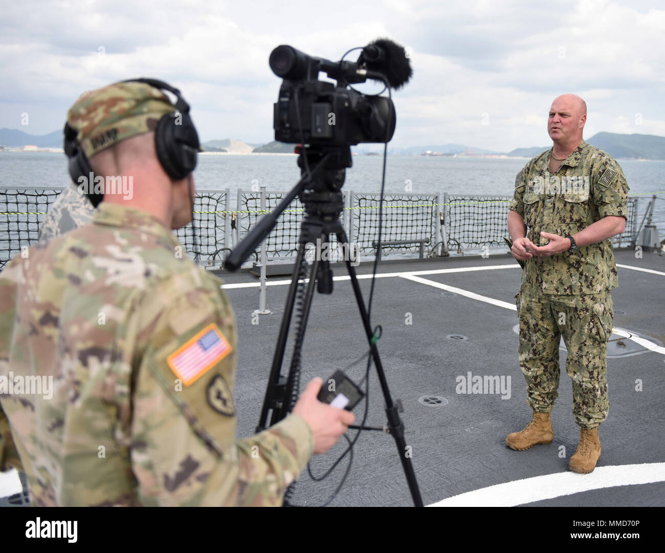 171019-N-TB148-533 BUSAN, Republic of Korea (Oct. 19, 2017) Capt. James Miller, commander, Mine Countermeasures Squadron (COMMCMRON) 7 gives an on-camera interview for soldiers from the Armed Forces Network (AFN) aboard the ROKS Cheong Wang Bong (LST 686) during the annual Multinational Mine Warfare Exercise (MN MIWEX). MN MIWEX is a mine countermeasures exercise between the U.S., Republic of Korea, and U.N. Command Sending States meant to increase combined capabilities and readiness to respond to any contingency on the Korean peninsula. (U.S. Navy photo by Mass Communication Specialist Seaman Stock Photo