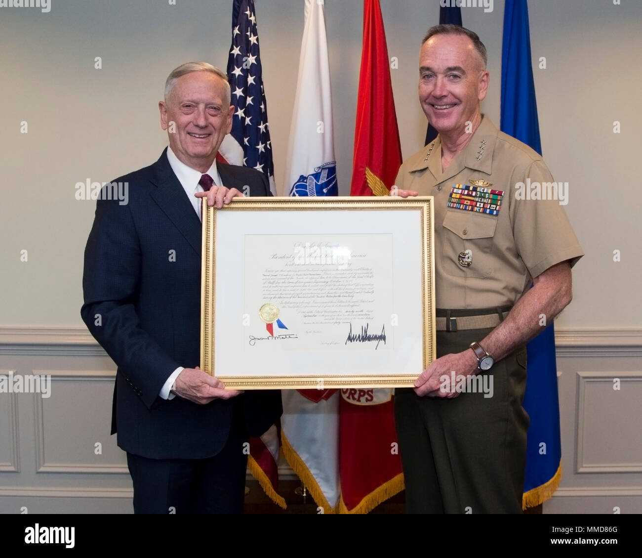 Defense Secretary James Mattis presents the Chairman of the Joint