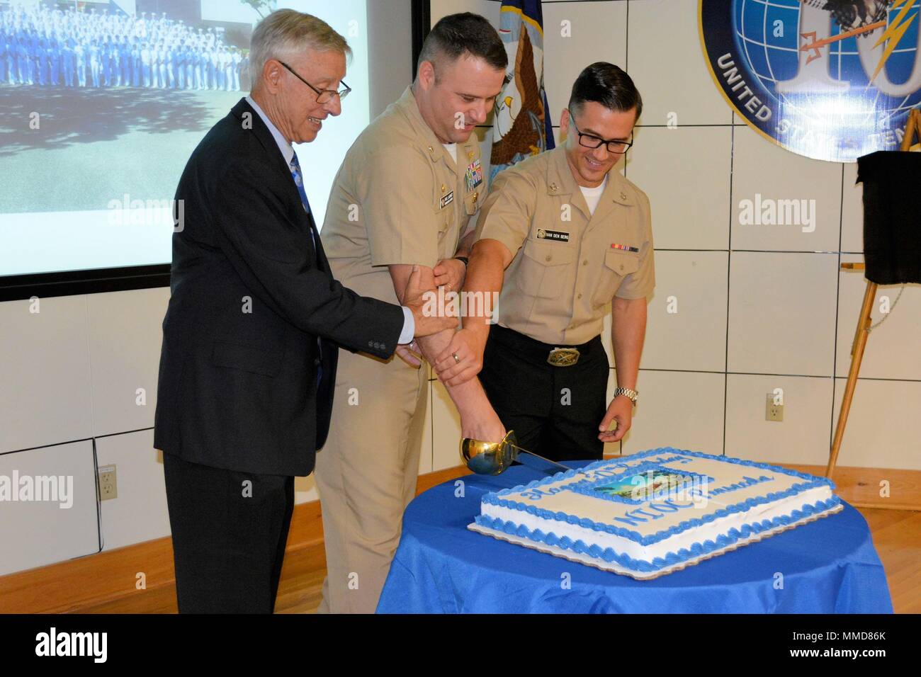 171006-N-AG811-024 PENSACOLA, Fla. (Oct. 6, 2017) – Retired Capt. Tom M.  Pigoski, former officer in charge of Navy Security Group Detachment (NSGD)  Pensacola (left), Cmdr. Paul D. Lashmet, commanding officer of Navy