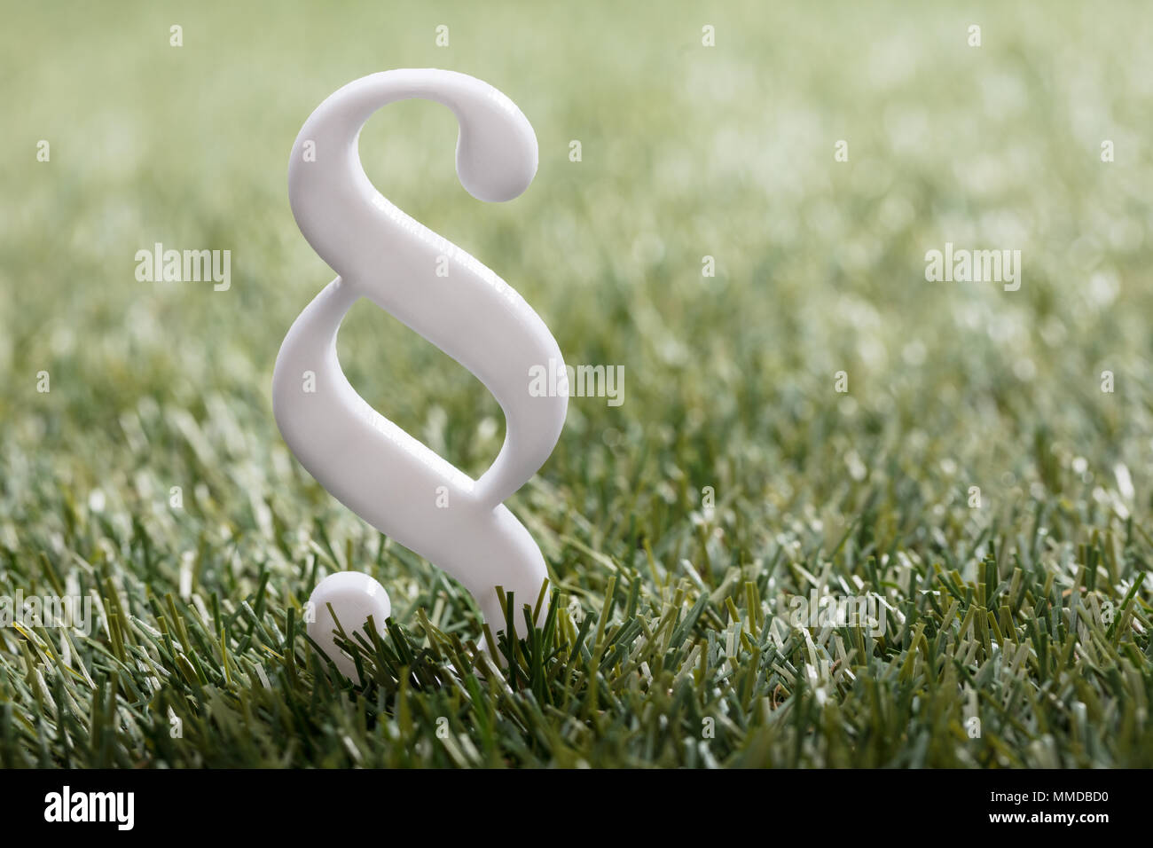 High Angle View Of White Paragraph Symbol On Green Grass Stock Photo