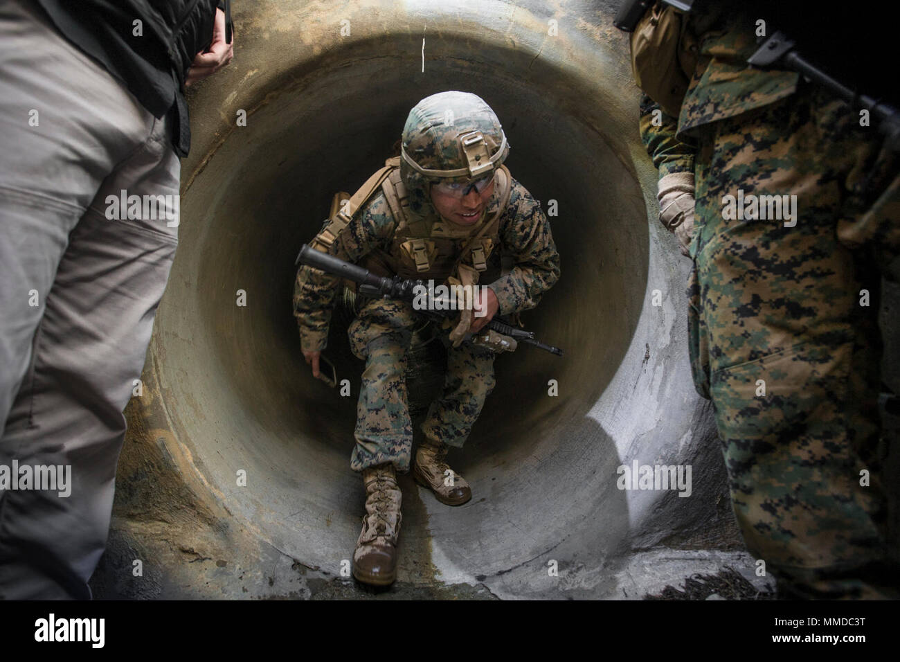 U.S. Marine Corps Lance Cpl. Alberto Ramirez, an infantryman with 3rd Battalion, 4th Marines, utilizes a communication system while underground during Urban Advanced Naval Technology Exercise 2018 (ANTX18) at Marine Corps Base Camp Pendleton, California, March 19, 2018. The Marines are testing next generation technologies to provide the opportunity to assess the operational utility of emerging technologies and engineering innovations that improve the Marine’s survivability, lethality and connectivity in complex urban environments. (U.S. Marine Corps Stock Photo