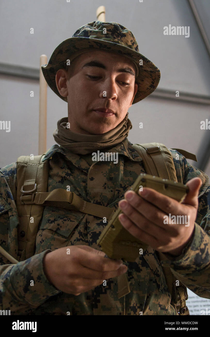 U.S. Marine Corps Lance Cpl. James Francis, an infantryman with 3rd Battalion, 4th Marine Regiment, 1st Marine Division, wears a concept communication system during Urban Advanced Naval Technology Exercise 2018 (ANTX18) at Marine Corps Base Camp Pendleton, California, March 20, 2018. The Marines are testing next generation technologies to provide the opportunity to assess the operational utility of emerging technologies and engineering innovations that improve the Marine’s survivability, lethality and connectivity in complex urban environments. (U.S. Marine Corps Stock Photo