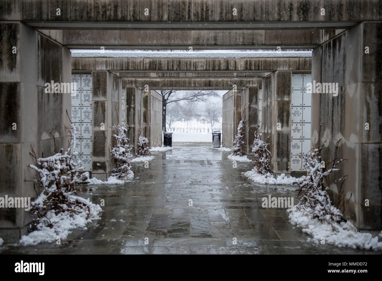 Snow falls in Columbarium Court 9 of Arlington National Cemetery, Arlington, Virginia, March 21, 2018. This was the second day of spring when a snow storm hit the national capital region. (U.S. Army Stock Photo