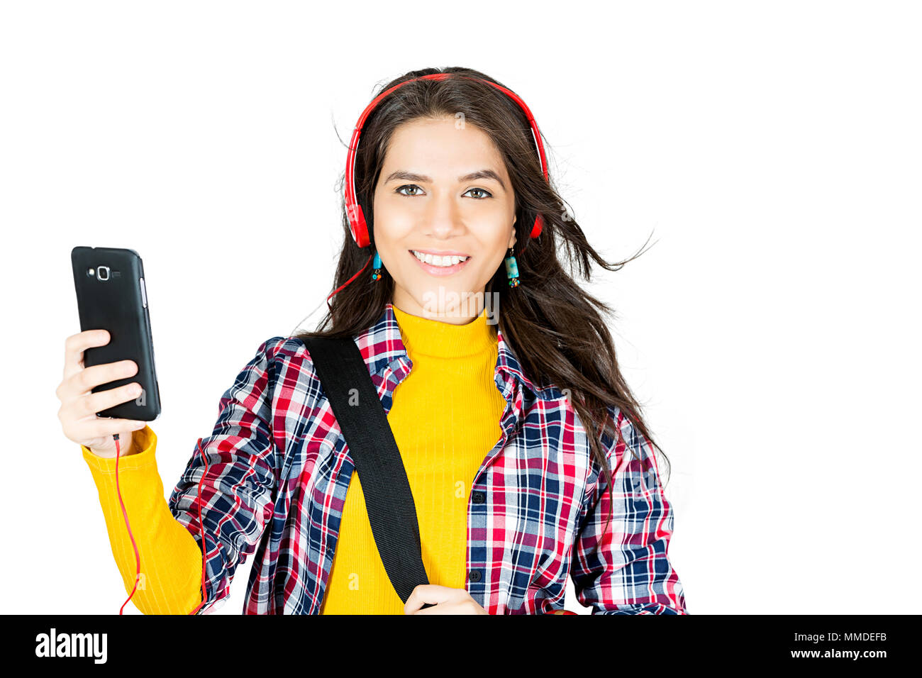 One Young Woman College Student listening music through Headphone Enjoying Stock Photo