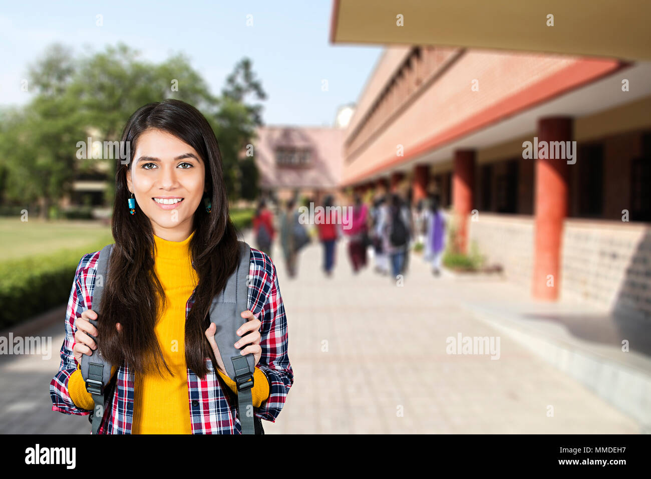 One Young Woman College Student Carrying Bag On White Background Stock Photo