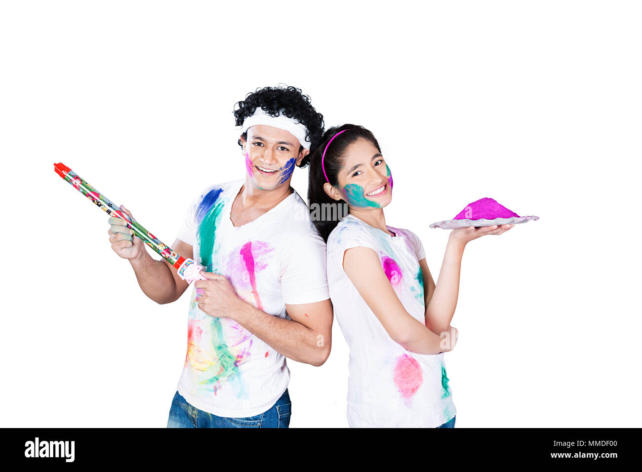 Two Young Friend playing colours with pichkari Holi Festival Celebrating Stock Photo