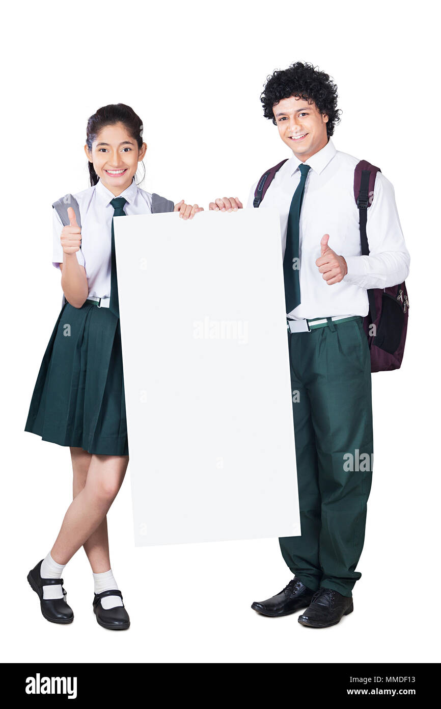 Two Teenage Boy And girl School Students Showing thumbs-up With Whiteboard Stock Photo