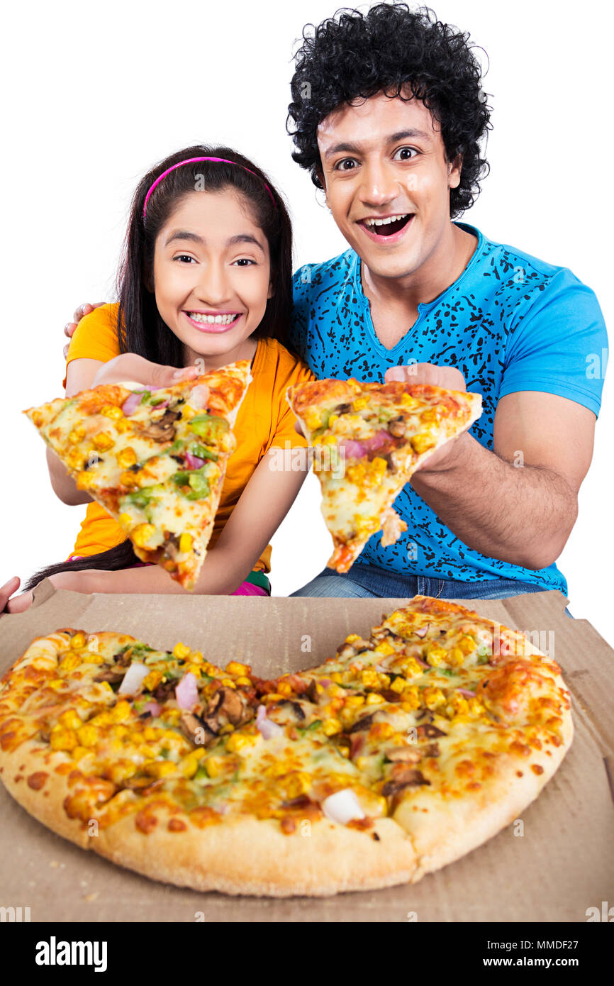Two Teenage Friend Giving Tasty veg Pizza Offering Temptation Stock Photo