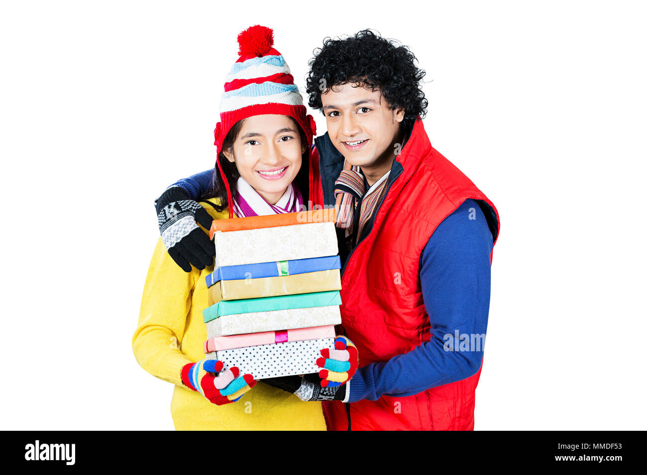 Two Young Friend In-Winter Clothes Holding Gifts Boxes Birthday Celebration Stock Photo