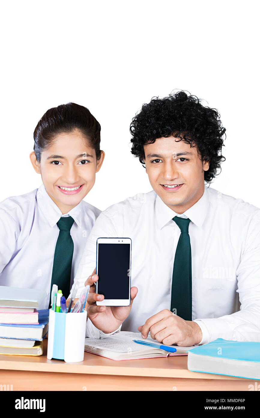 Two Teenager School Students Friend Showing Mobile Phone In-Class Stock Photo
