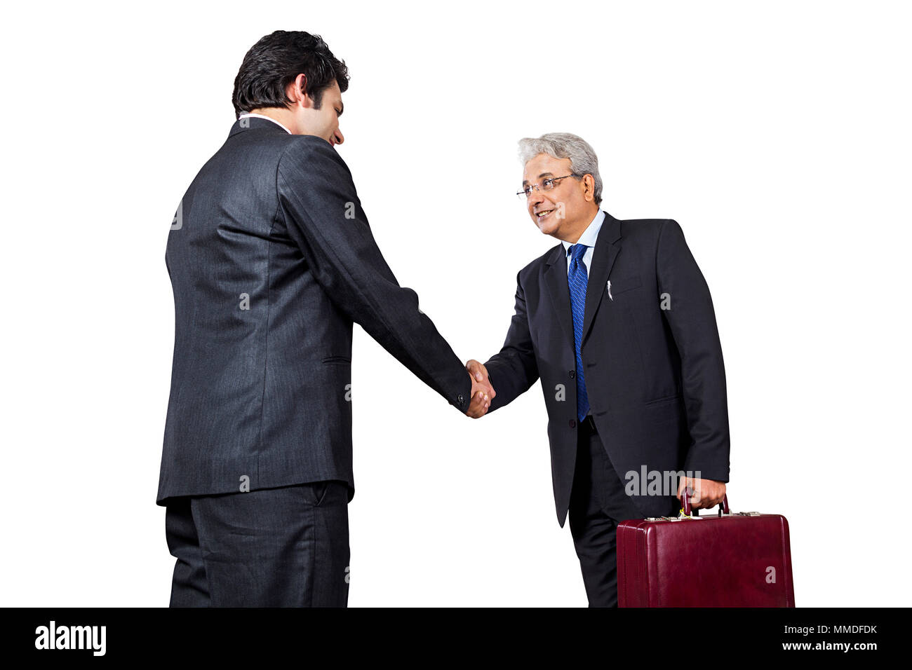 Two Businessmen with briefcases Handshaking on white Background Stock Photo