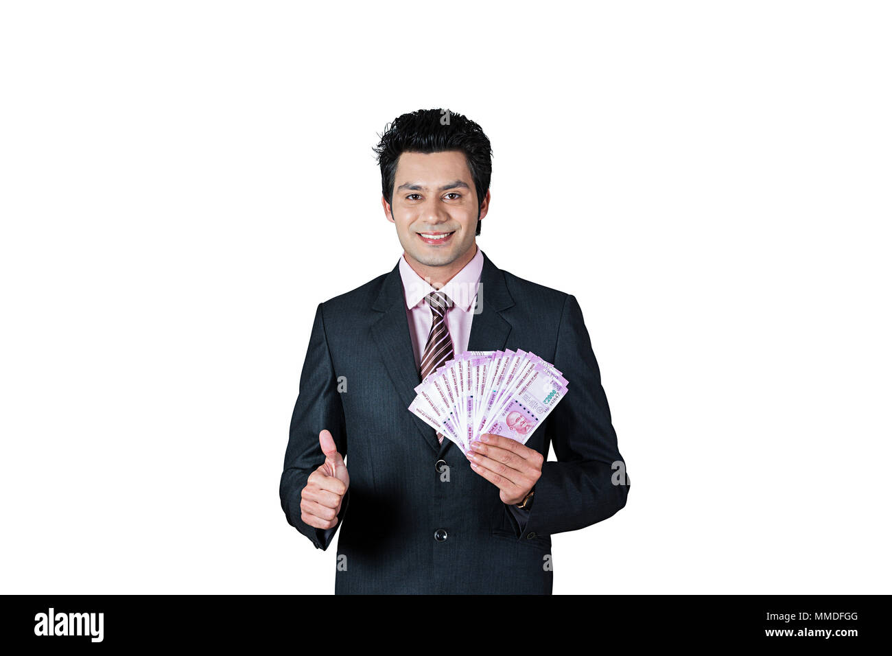 One Businessman Showing Thumbs-up With Indian Currency Two-Thousand rupee Banknotes Stock Photo