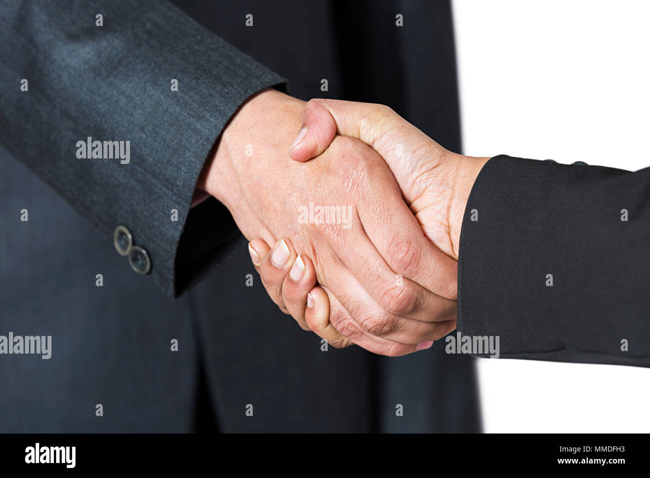 Two businessmen hand shaking after good deal.BUsiness Success Stock Photo