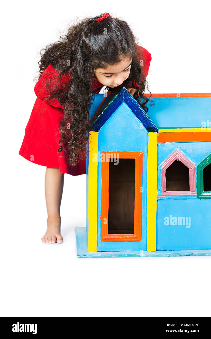 One kid Girl Watching Dummy House Dreaming New Home Real-Estate Concept Stock Photo