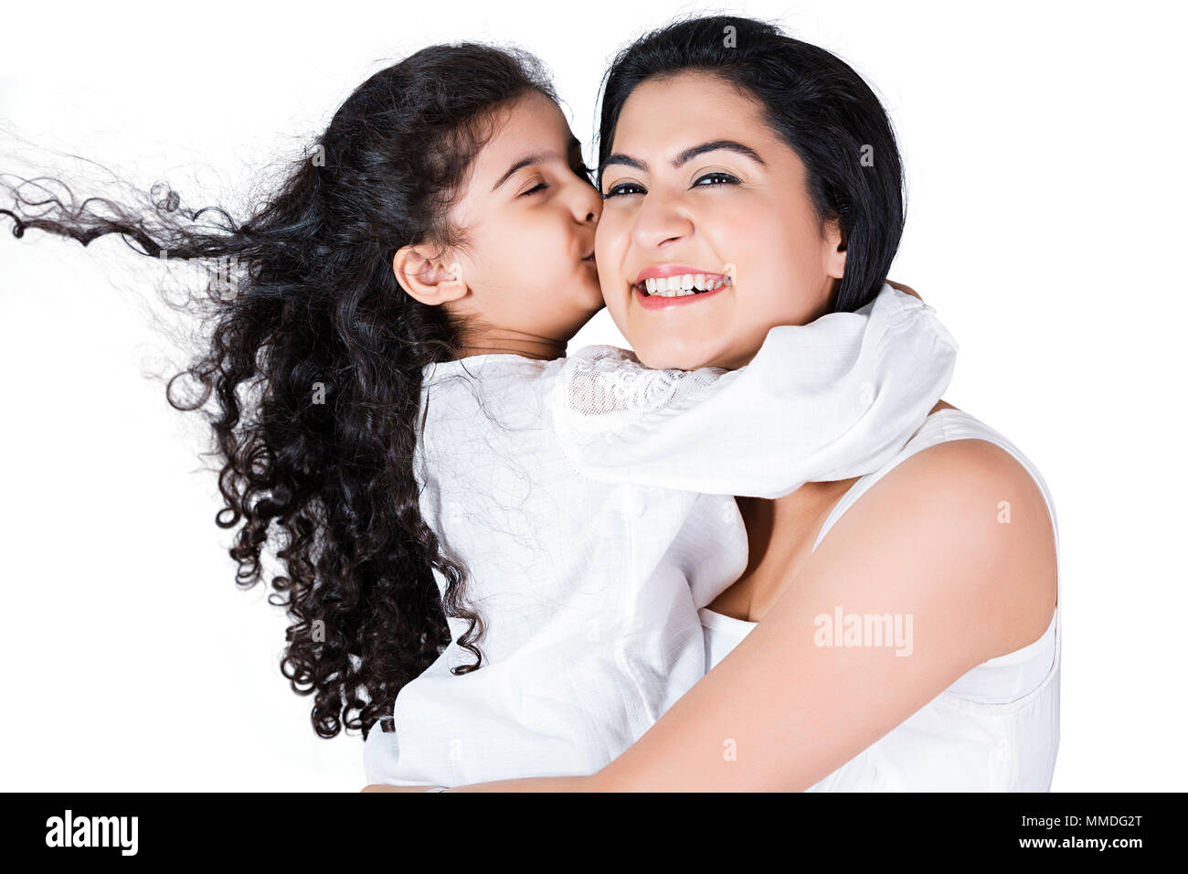 Happy Kid Girl Daughter Giving A Kiss To Her Mother Loving Fun Stock Photo