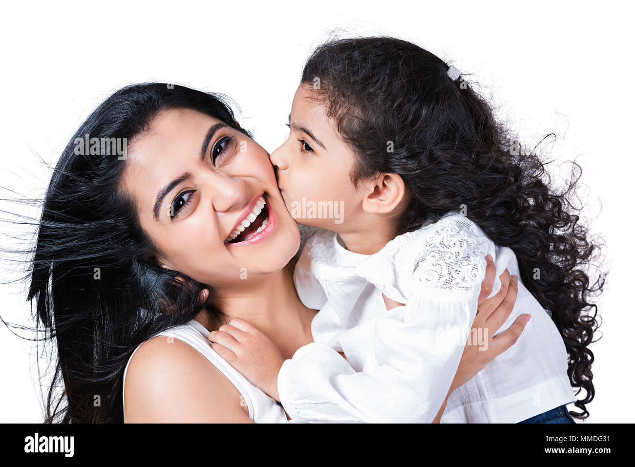 Happy Little Daughter Giving A Kiss To Her Mother Loving Fun Cheerful Stock Photo