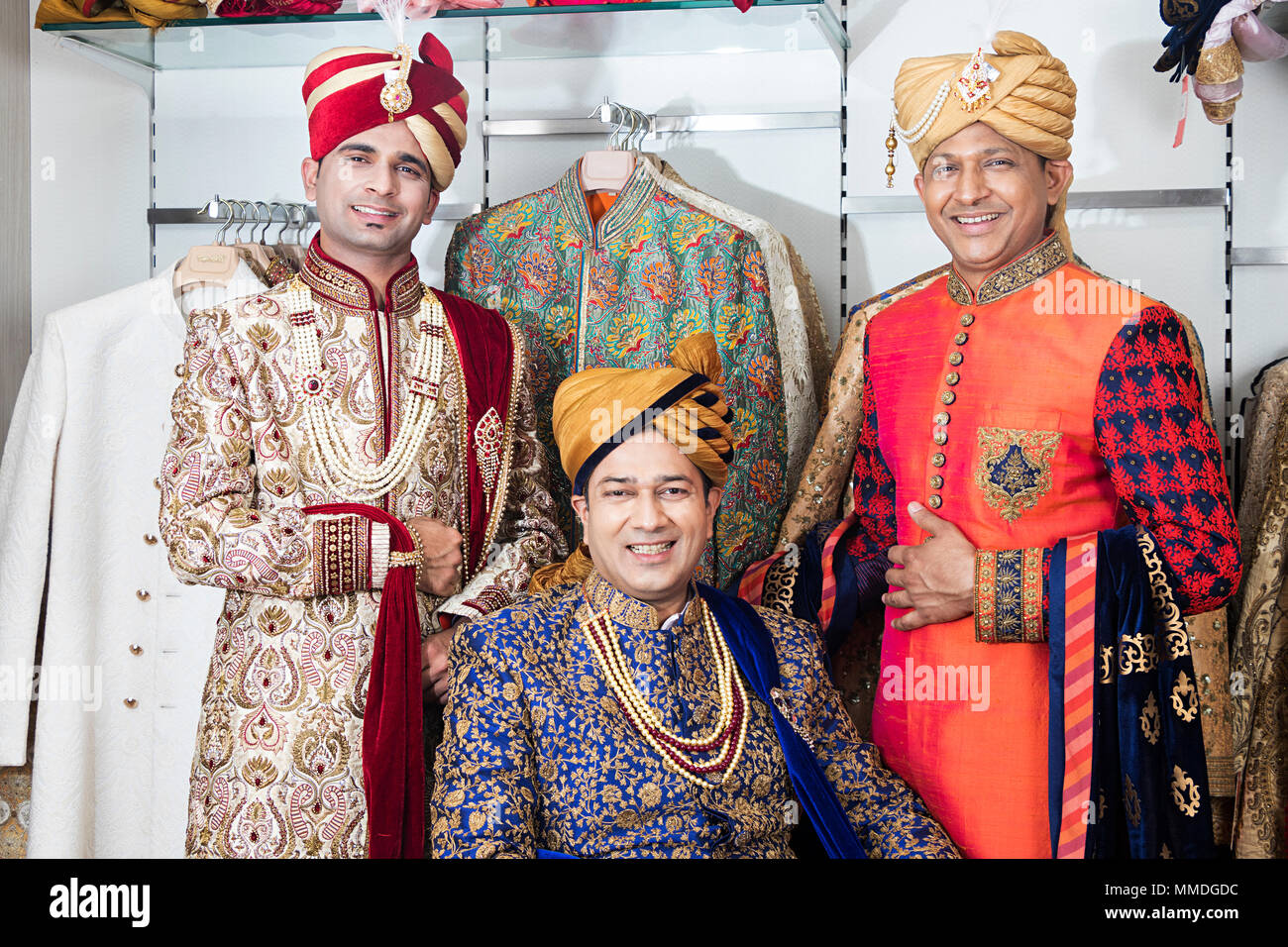 Threee Mens Brothers Wedding Sherwani -Dress Customer Shopping Buying Clothes Market-Shop Stock Photo