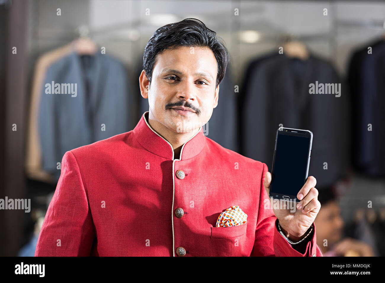 One Adult Male Customer Showing Smartphone Screen In Store Market Stock Photo