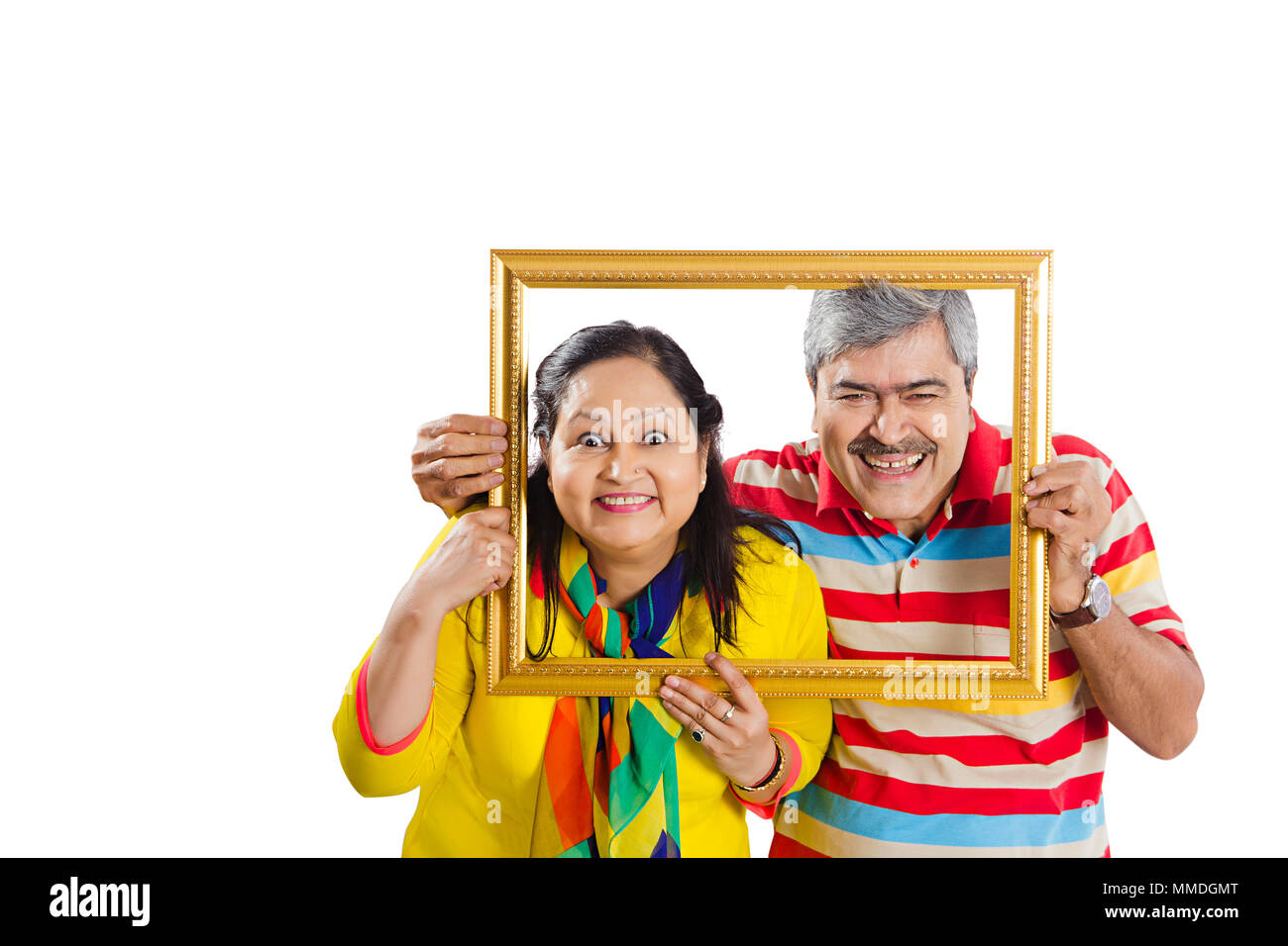 Two Senior Couple Holding Photo Frame Over Face Fun Enjoy Stock Photo